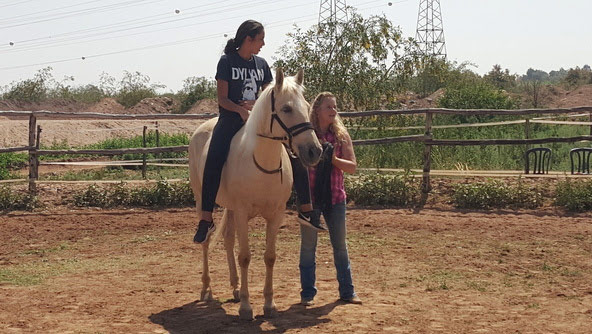 Anna Twinney works with a young student in Morocco.